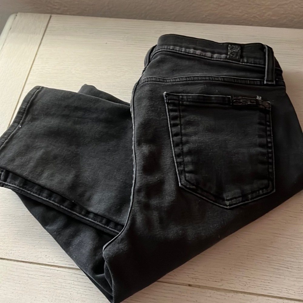Black skinny ankle jeans with rip on knees gently used